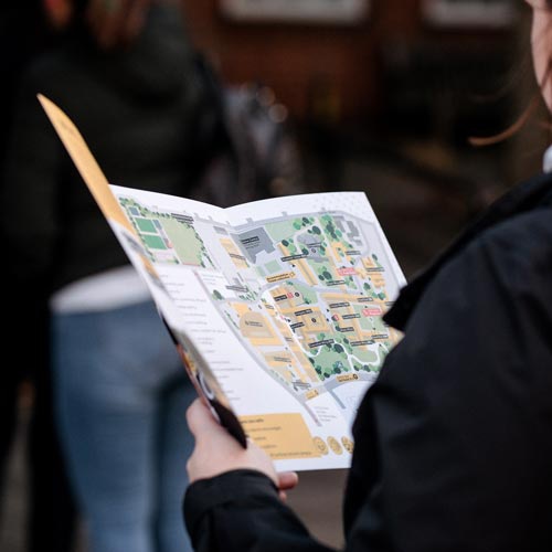 Close up of visitor looking at Open day campus map 