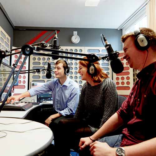 Students in radio recording studio 