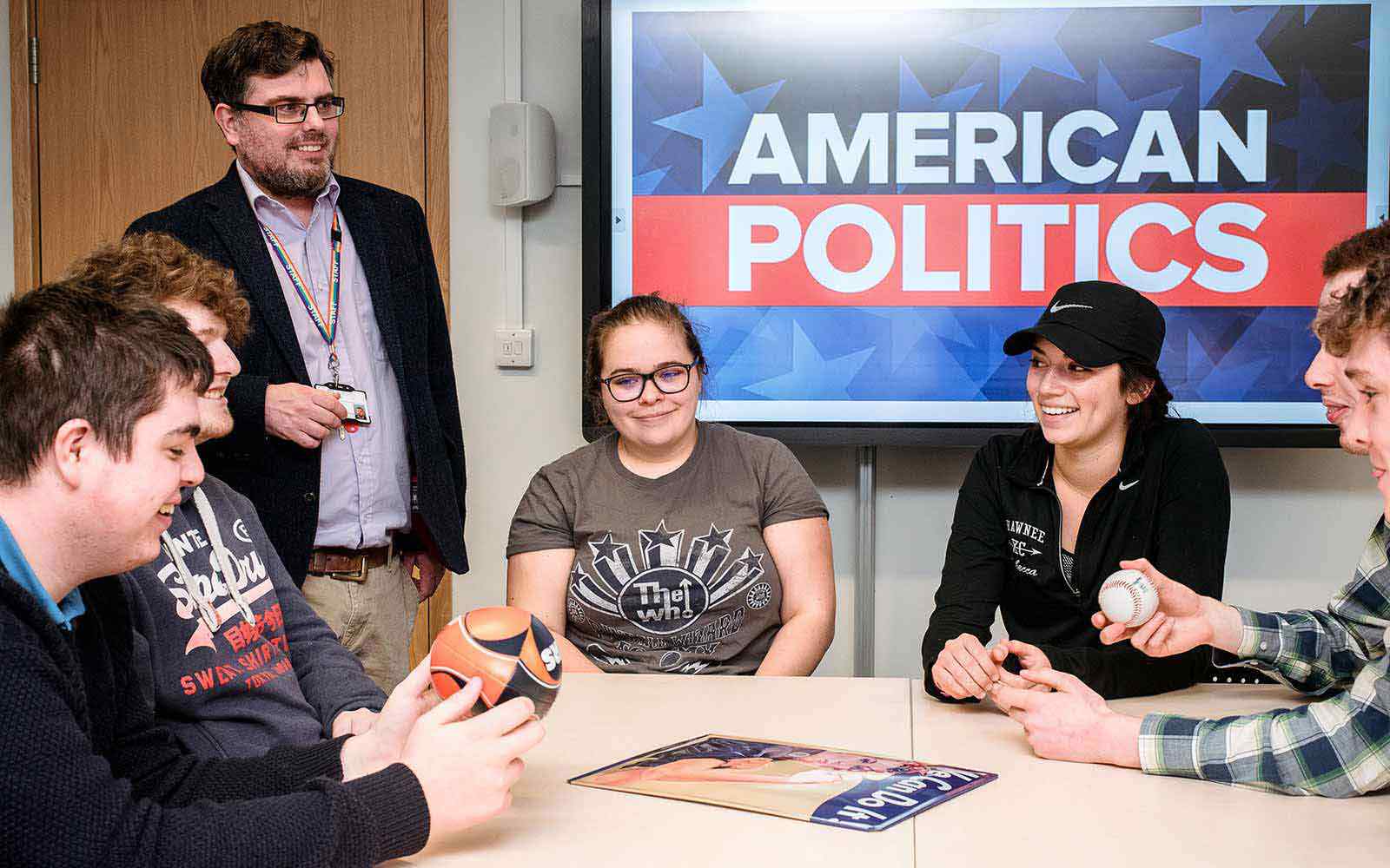 students and lecturer discuss American politics  