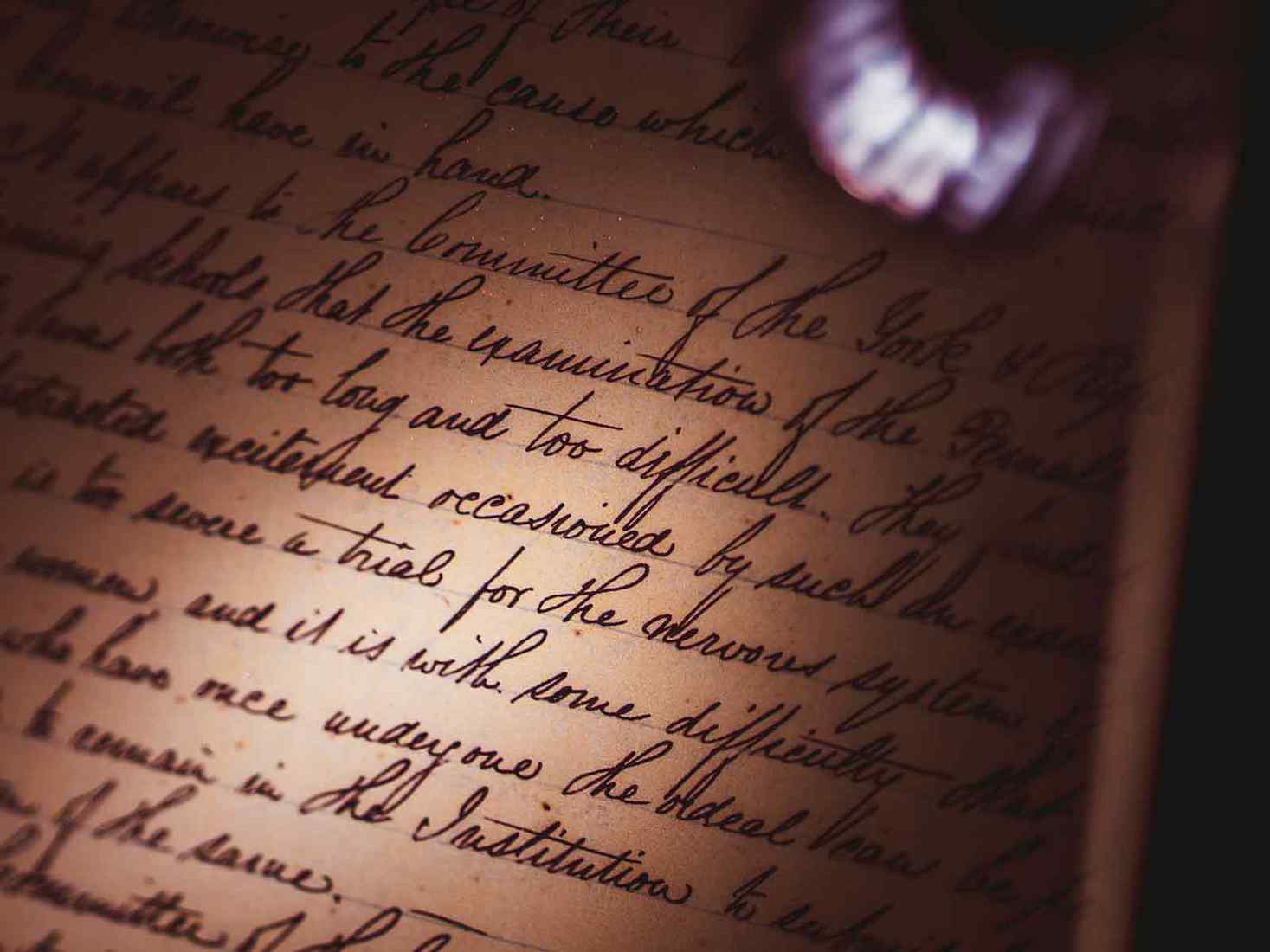Calligraphy in a book under a spotlight 