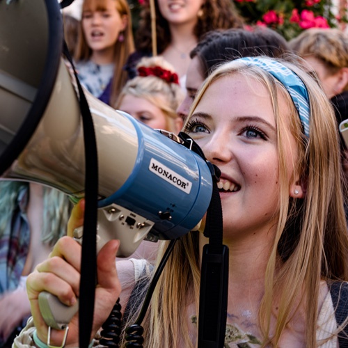Student using megaphone at climate change protest 