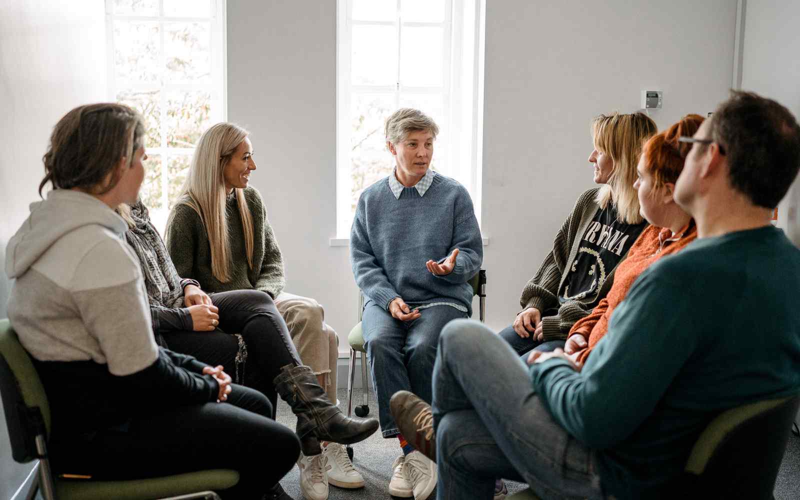 Counselling students sat around in circle 