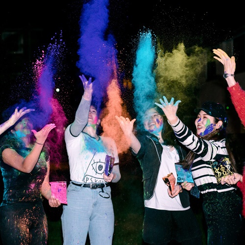 Students throwing colours for Holi 