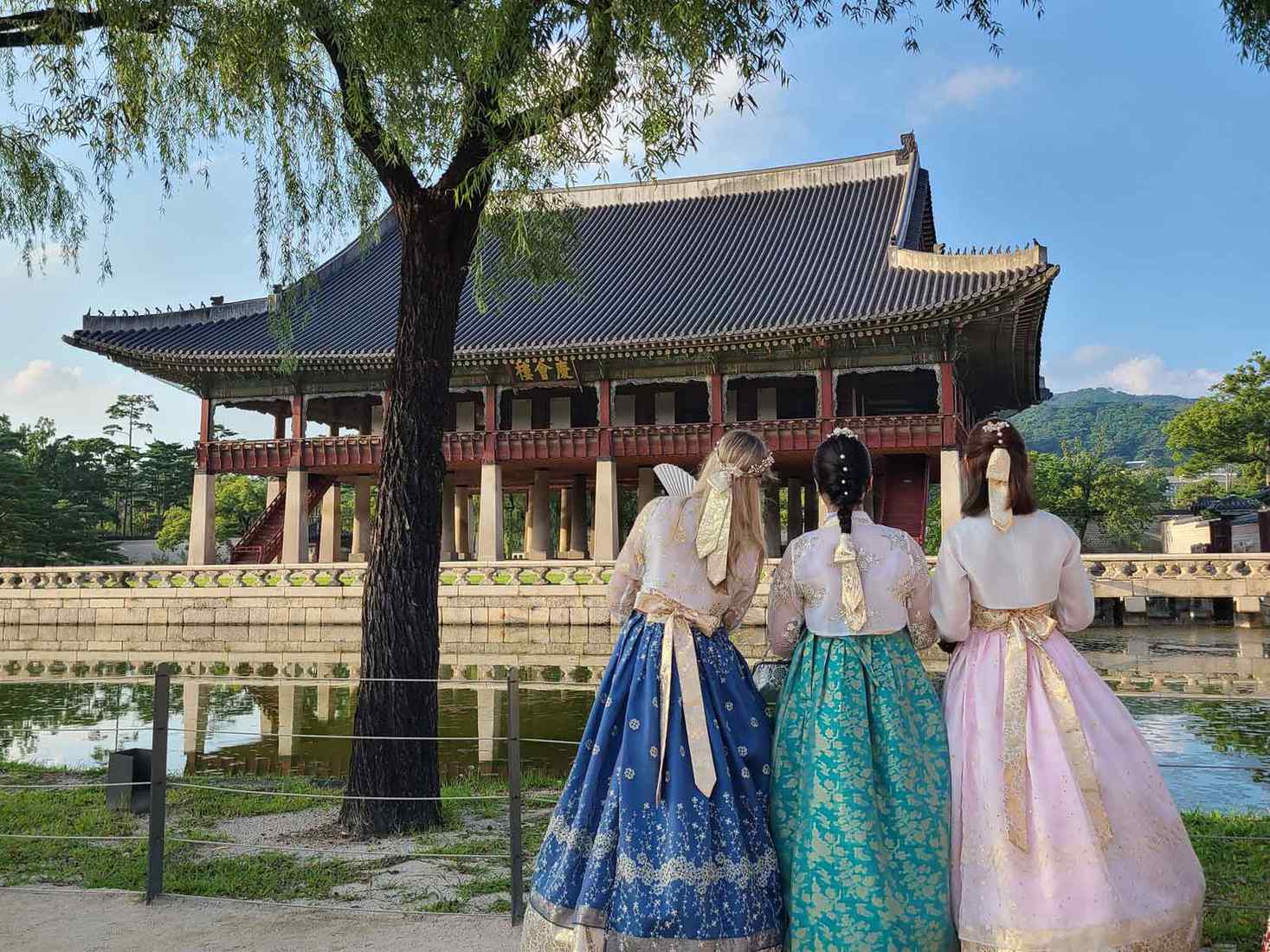 Three students at Gyeongbokgung Palace in Seoul, South Korea. 
