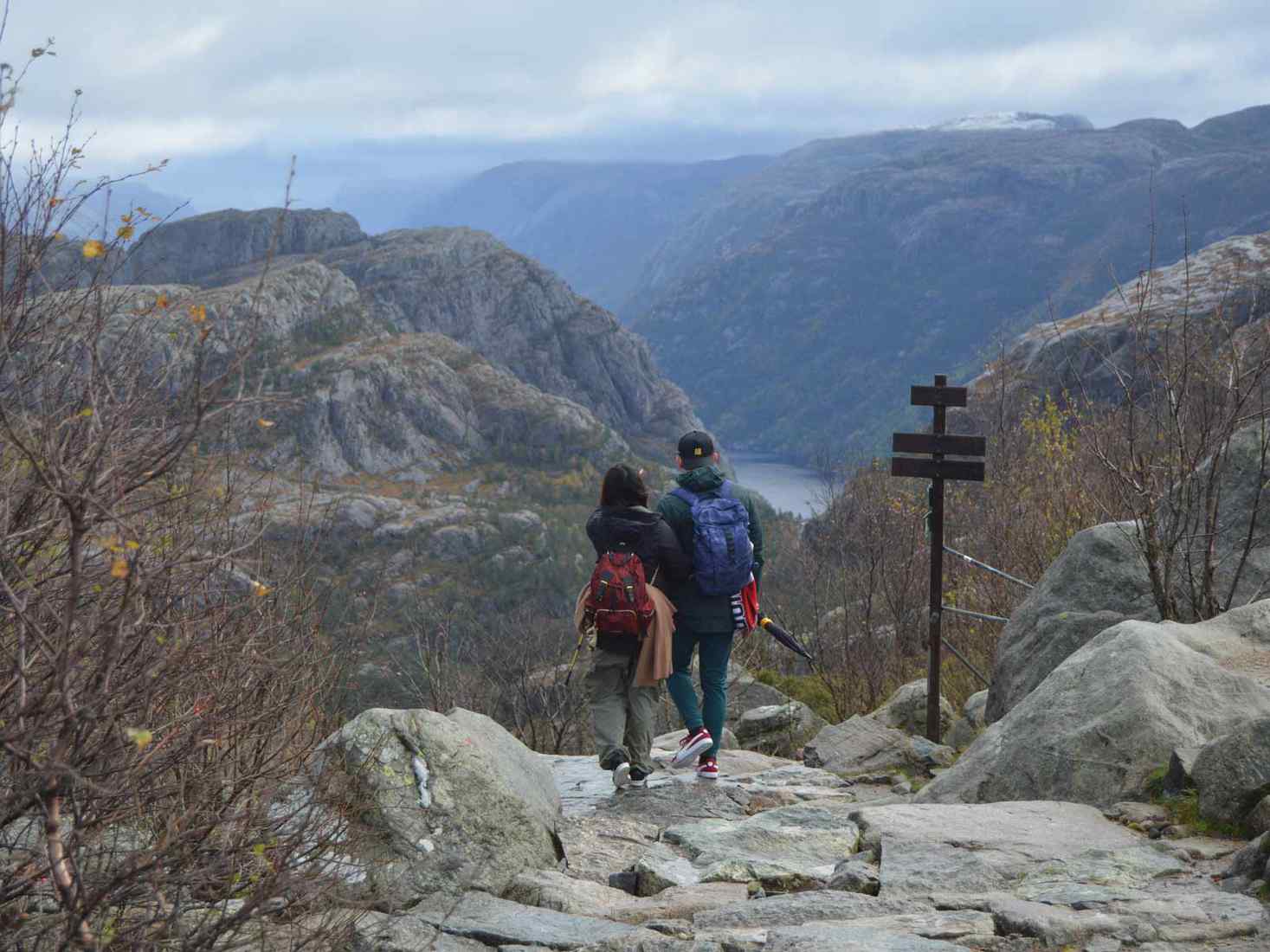 Two study abroad students hiking together in the mountains. 