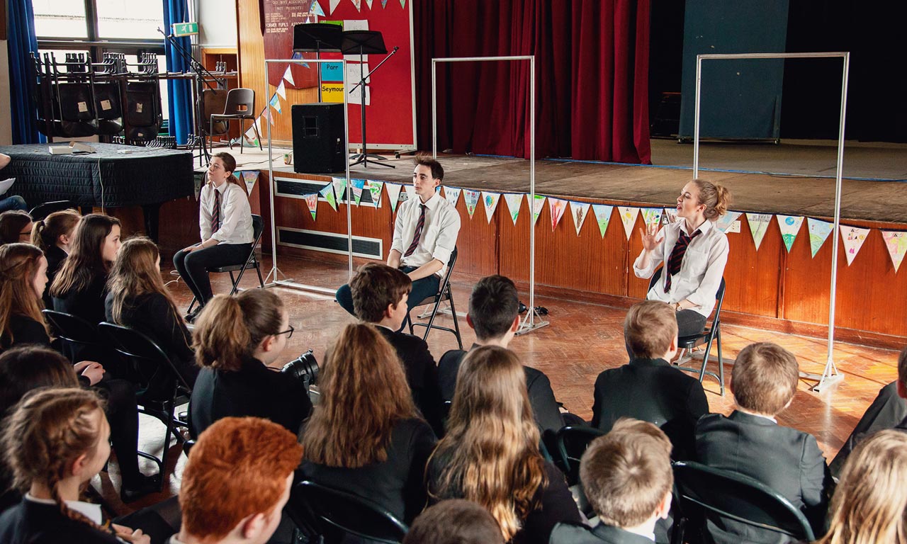 School pupils watching Its Not OK performance 