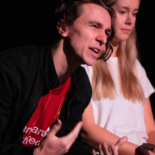 Two actors performing in the It's Not Love play 