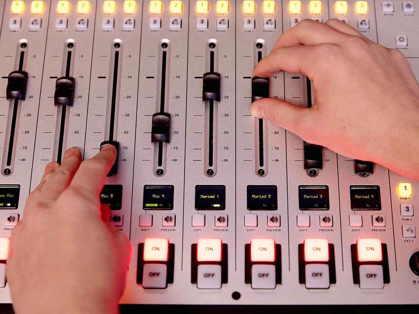 Overhead view of an audio mixing desk. 