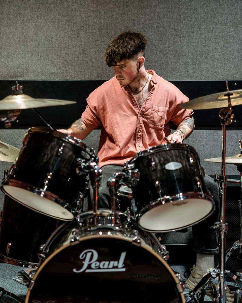 A music student plays drums. 