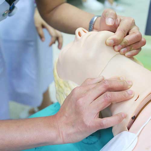Nursing student practising resuscitation 