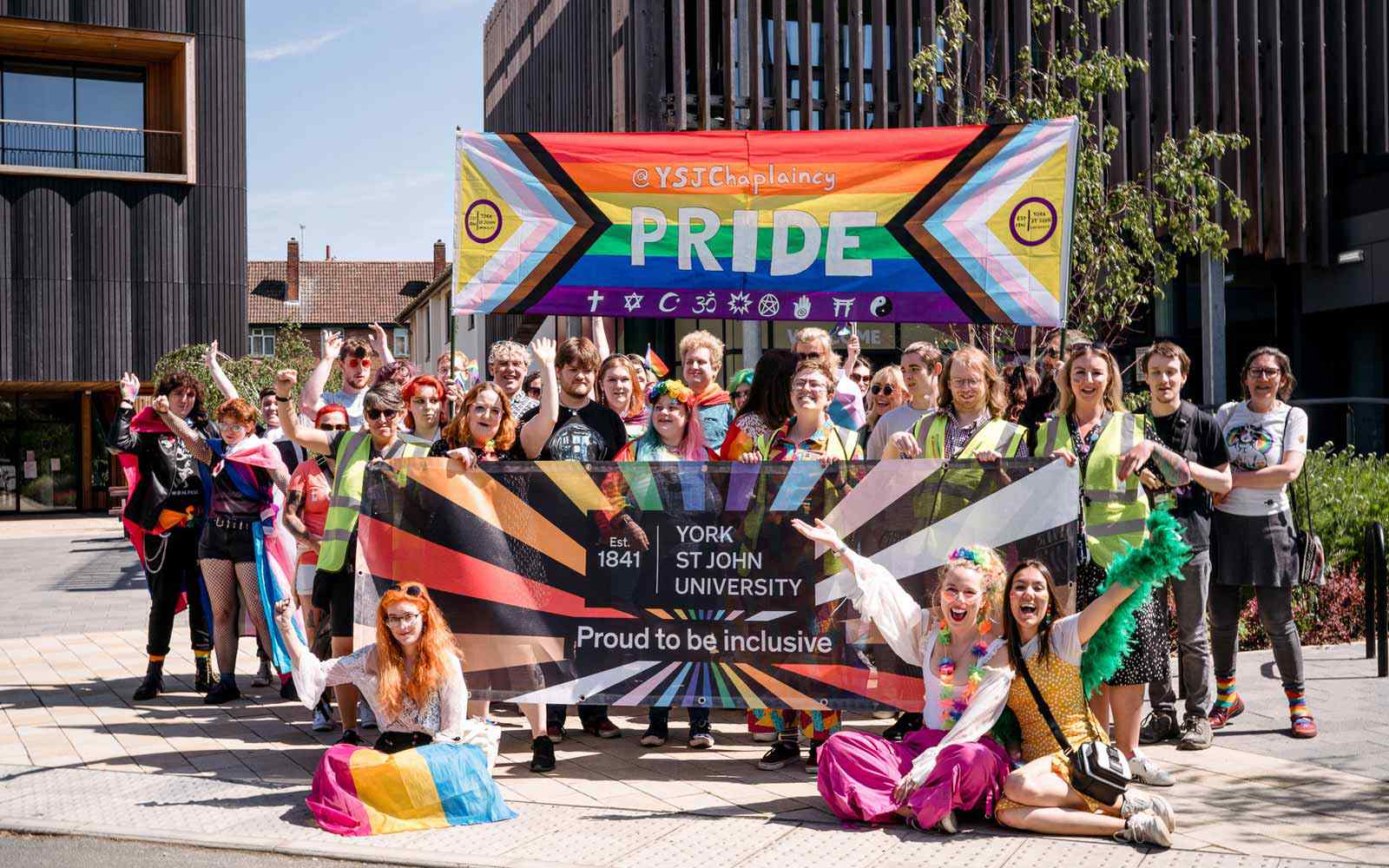 Group of students with banners at Pride 2023 