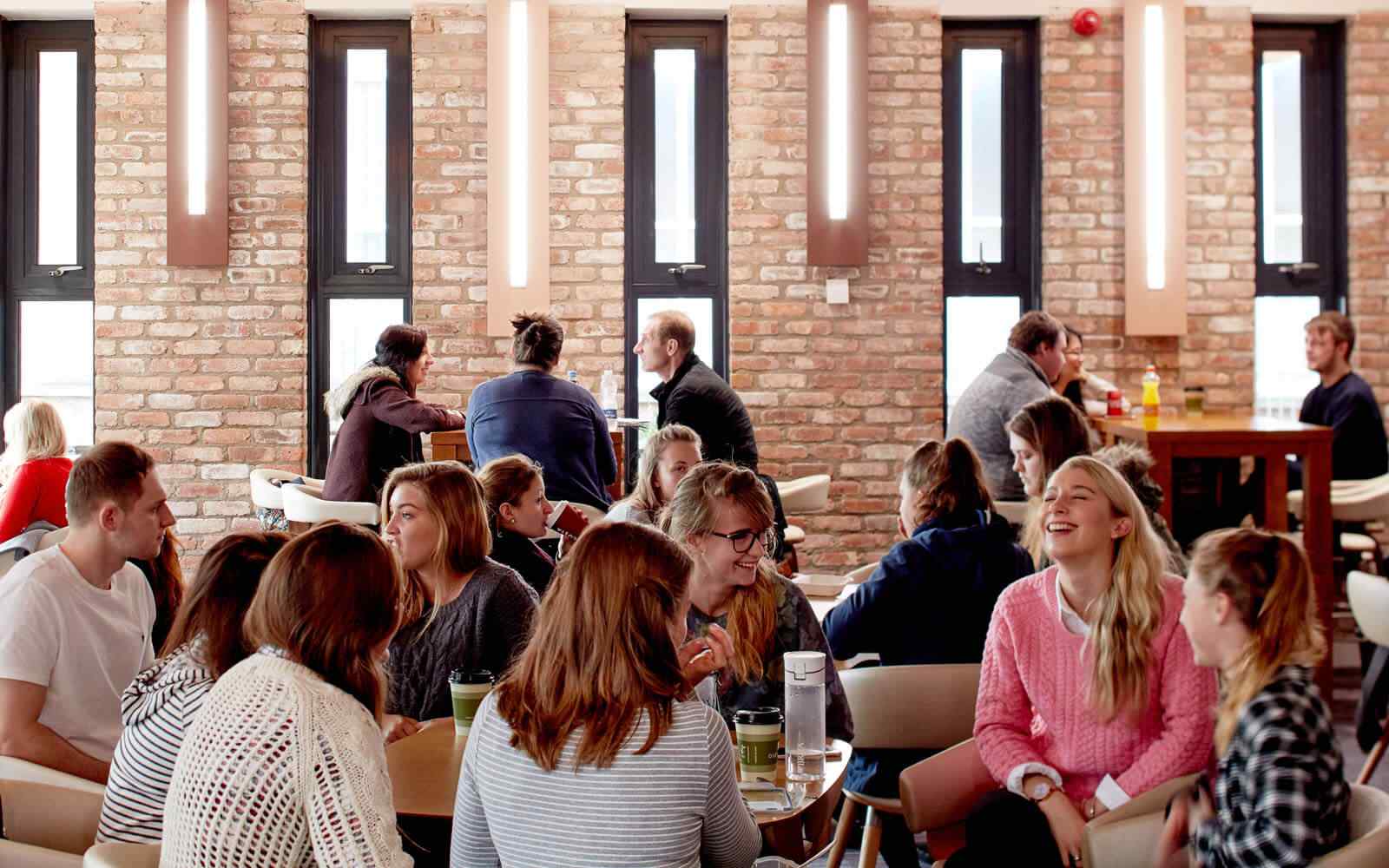 Students sat at tables in main dining hall 