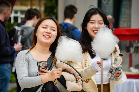 Students with candy floss at Welcome Week 